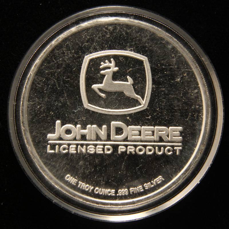 lot 35 image: 1 TROY OZ. .999 FINE SILVER JOHN DEERE 310 TRACTOR IN AIRTITE