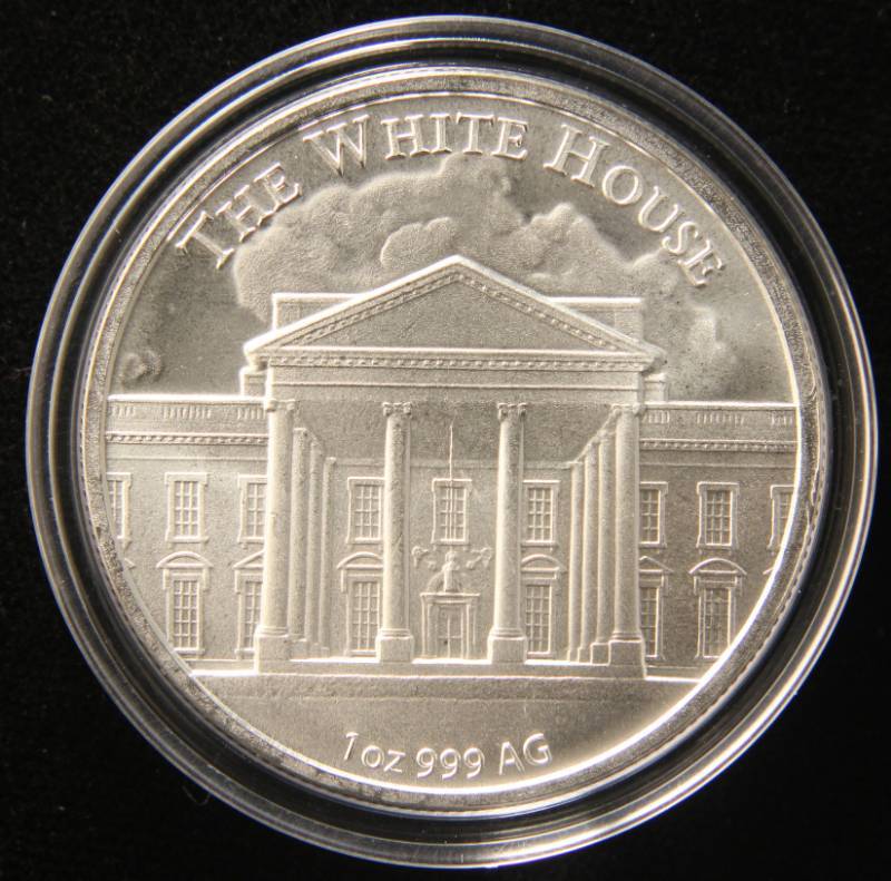 lot 42 image: 1 TROY OZ. .999 FINE SILVER DONALD TRUMP ROUND IN AIRTITE HOLDER