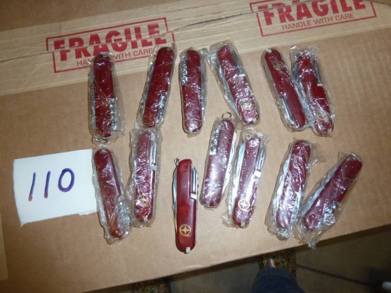 lot 110 image: 13 swiss army knives...