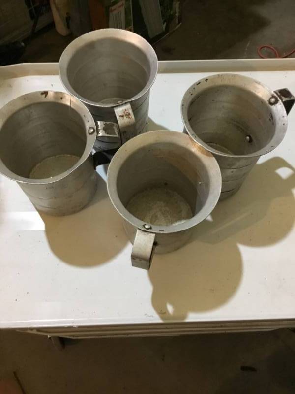 Lot of 4 2 Liter aluminium measuring cups.