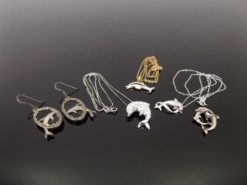lot 43 image: .925 Sterling Silver Lot of Dolphin Themed Necklaces, Earrings, etc.