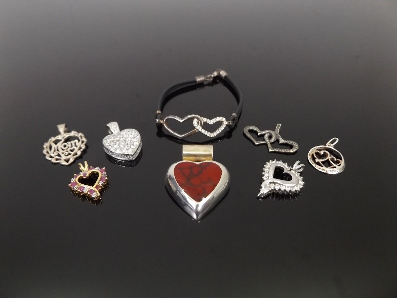 lot 46 image: .925 Sterling Silver Lot of 8 Heart Themed Pendants and a Bracelet