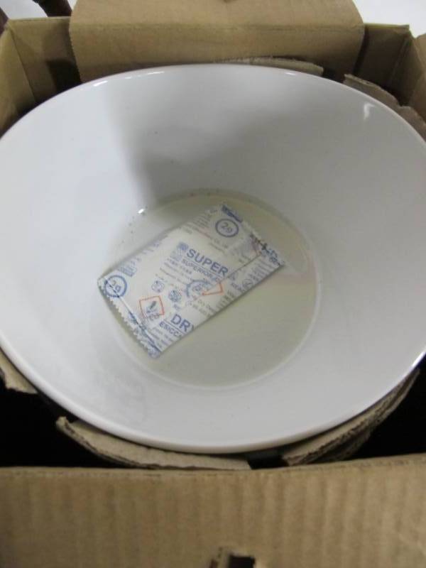 lot 42 image: Over and Back White Porcelain Wavy Bowl Set, 4-pack