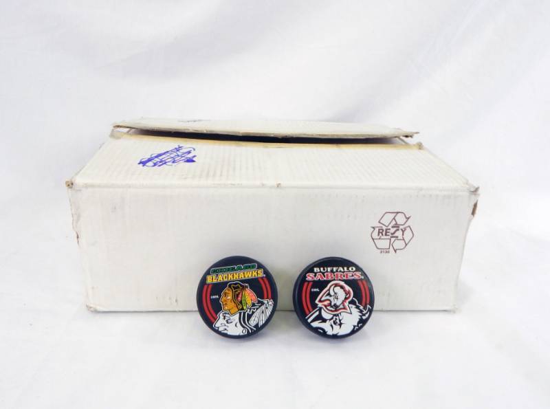 lot 99 image: Lot of Buffalo Sabres and Chicago Blackhawks NHL Team Pucks