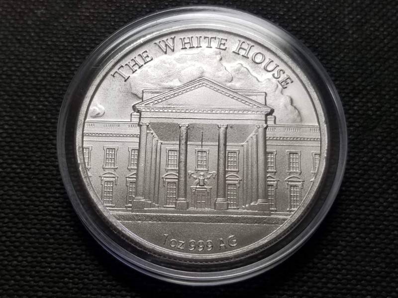 lot 26 image: 1 TROY OZ. .999 FINE SILVER DONALD TRUMP ROUND IN AIRTITE HOLDER
