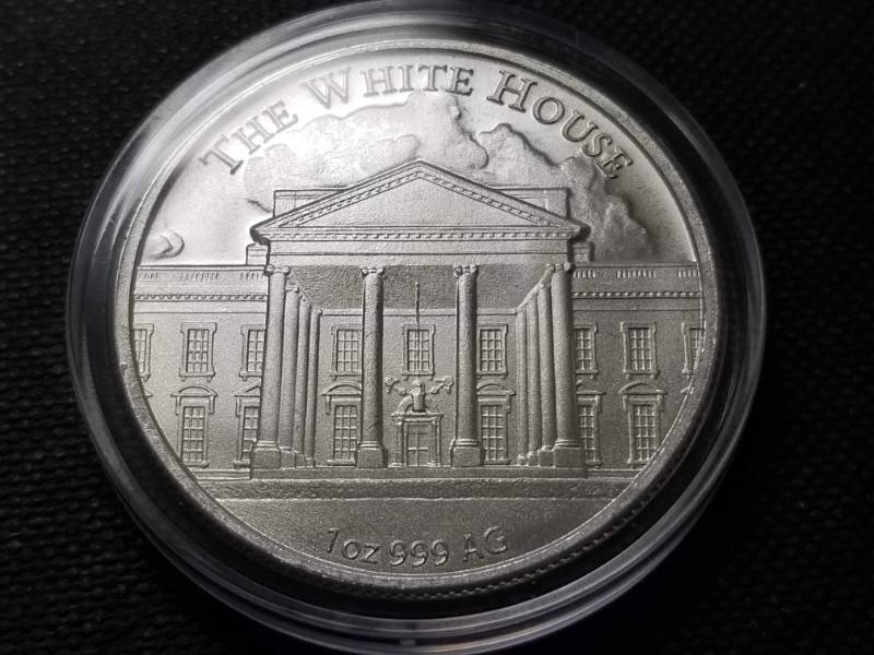 lot 57 image: 1 TROY OZ. .999 FINE SILVER DONALD TRUMP ROUND IN AIRTITE HOLDER