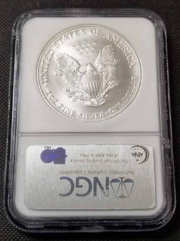 lot 61 image: 2004 AMERICAN SILVER EAGLE 1 TROY OZ. .999 FINE SILVER MS69 NGC