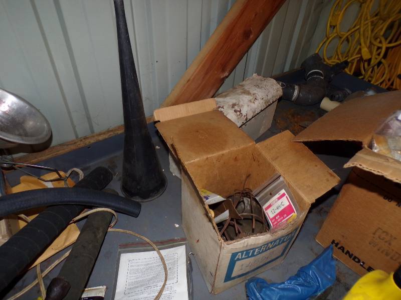 lot 39 image: Misl Tools and Auto parts Jack Oil, Funnels, and assorted Items on Table