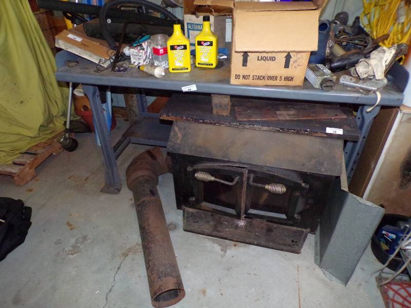 lot 40 image: Metal Work Bench 3 x 5 x 34 ONLY  Contents and stove not included