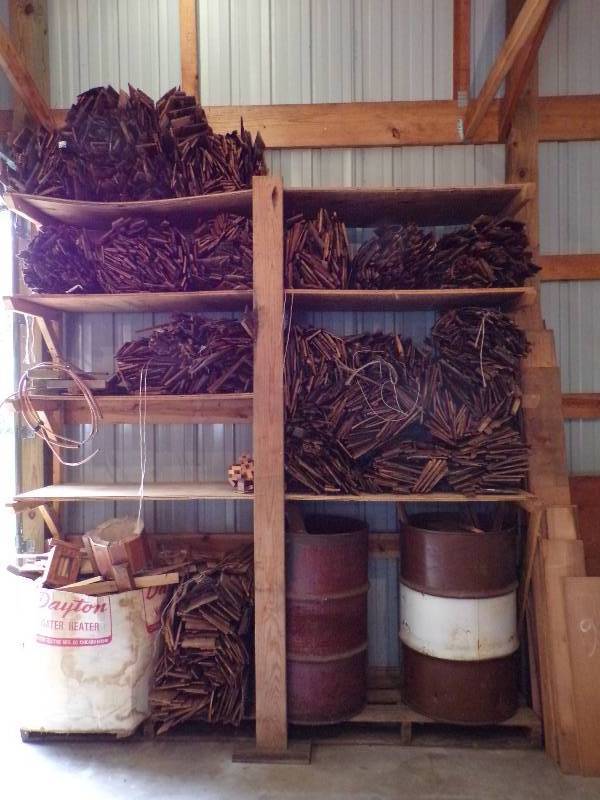 lot 79 image: Wall of Wood mostly Cedar Shakes and 2 metal barrels