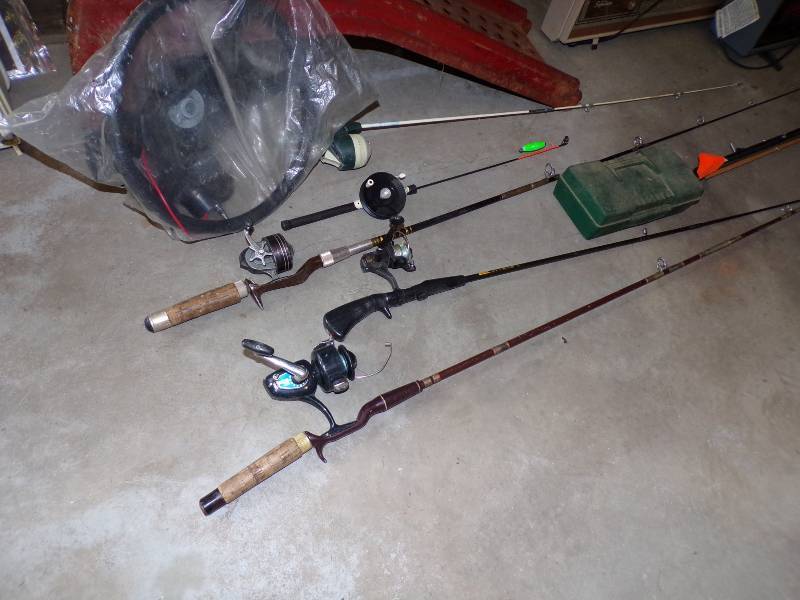 lot 87 image: Boat Steering Wheel and Fishing Poles with Reels and more