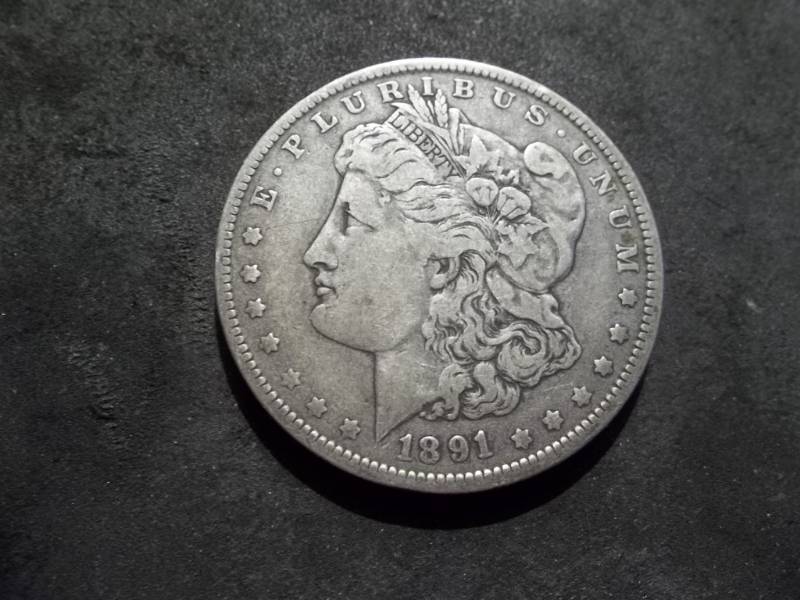 lot 27 image: 1891 O Morgan Silver Dollar