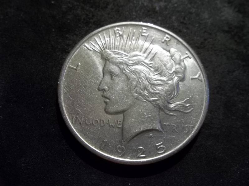 lot 48 image: 1925 Peace Silver Dollar