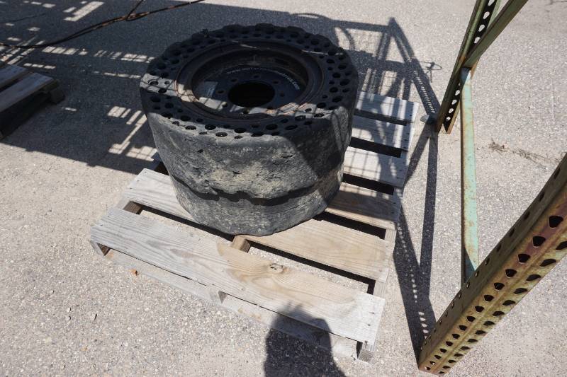 lot 29 image: Set of 4 - Bobcat Skid Loader Skid Steer Solid Tires & Rims