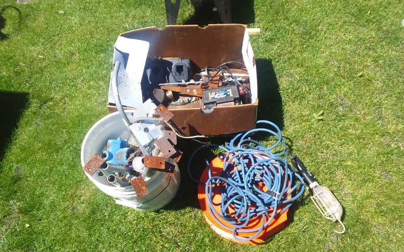 lot 26 image: Trouble Light, Cord Reel, Box With Wen Wet Wheel SharpenerHonerGrinder, Bucket With Piston Pump, Misc