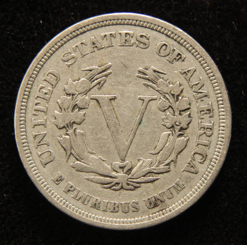 lot 31 image: 1883 no cents LIBERTY NICKEL with nice lamination error at 9 Oclock