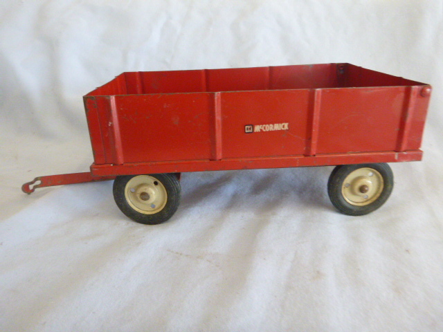 lot 63 image: Vintage Metal McCormick Wagon