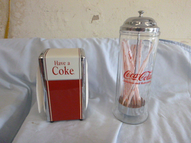 lot 73 image: Coca-Cola Napkin Dispenser and Straw Holder