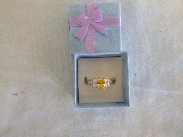 lot 147 image: Yellow and White Stone Ring