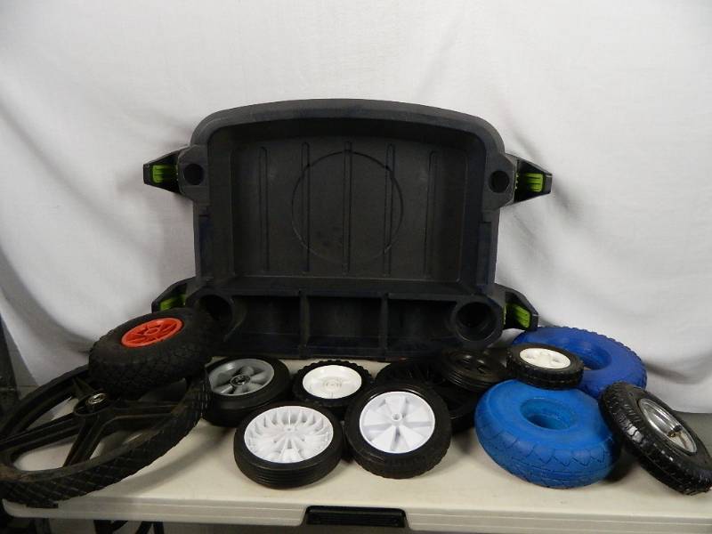 lot 54 image: New Wheelbarrow Caddy and New Tires