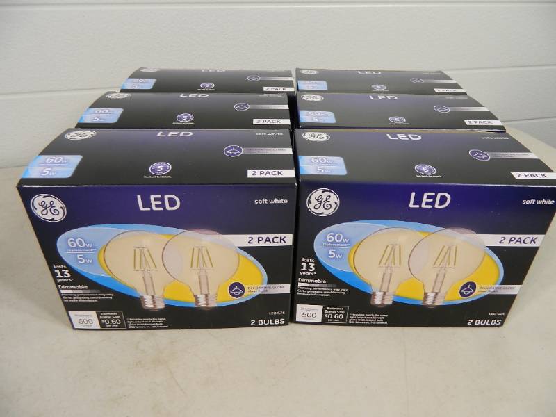 lot 126 image: 12 New GE 60 Watt LED Light Bulbs