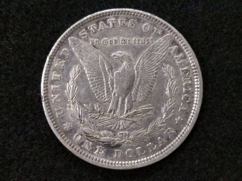lot 10 image: 1880 Morgan Silver Dollar...