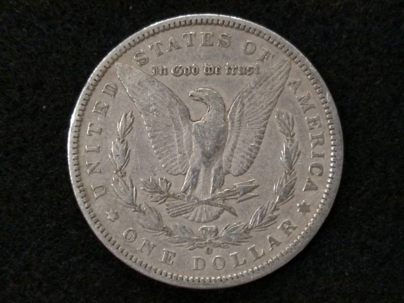 lot 28 image: 1890 O Morgan Silver Dollar...