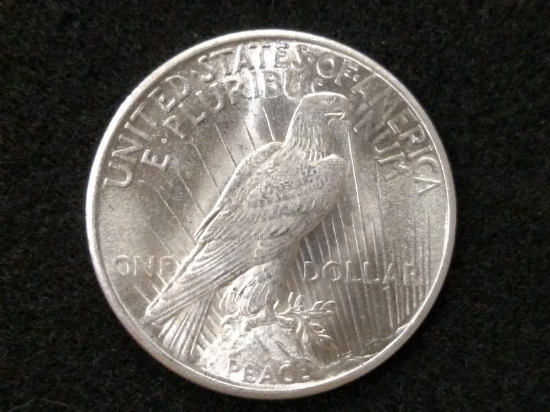 lot 75 image: 1925 Peace Silver Dollar...