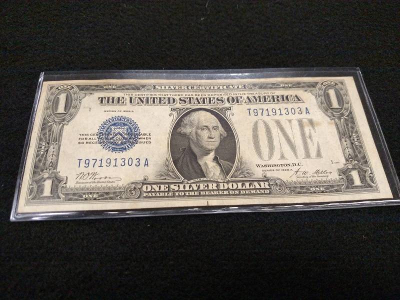 lot 179 image: 1928 A Funny Back One Dollar Silver...