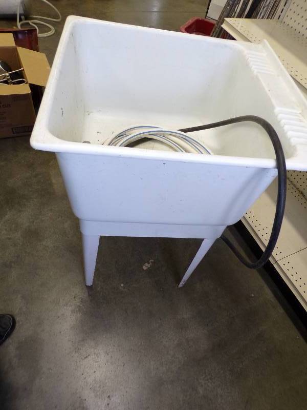lot 55 image: Laundry Tub with hose