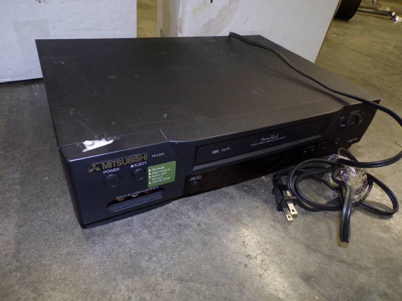 lot 65 image: VHS Player with 2 Large Boxes of VHS Movies