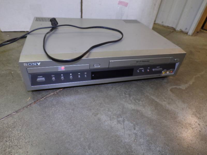 lot 66 image: VHS Player with 2 Large Boxes of VHS Movies