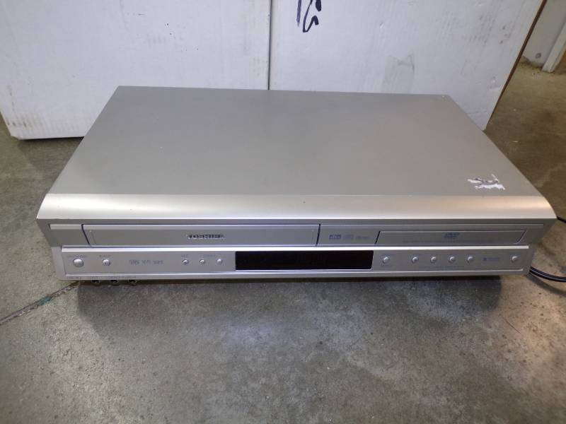 lot 67 image: VHS Player with 2 Large Boxes of VHS Movies
