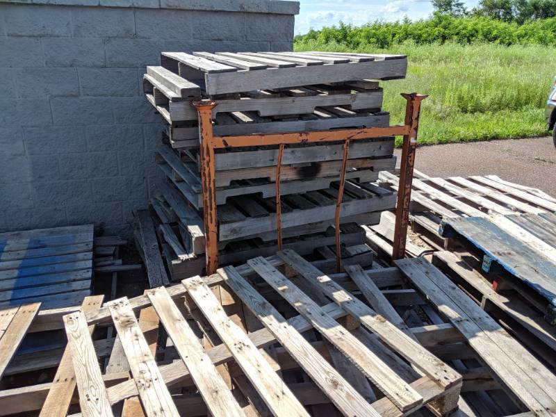 lot 200 image: Metal PalletRack Plus Pile of Pallets