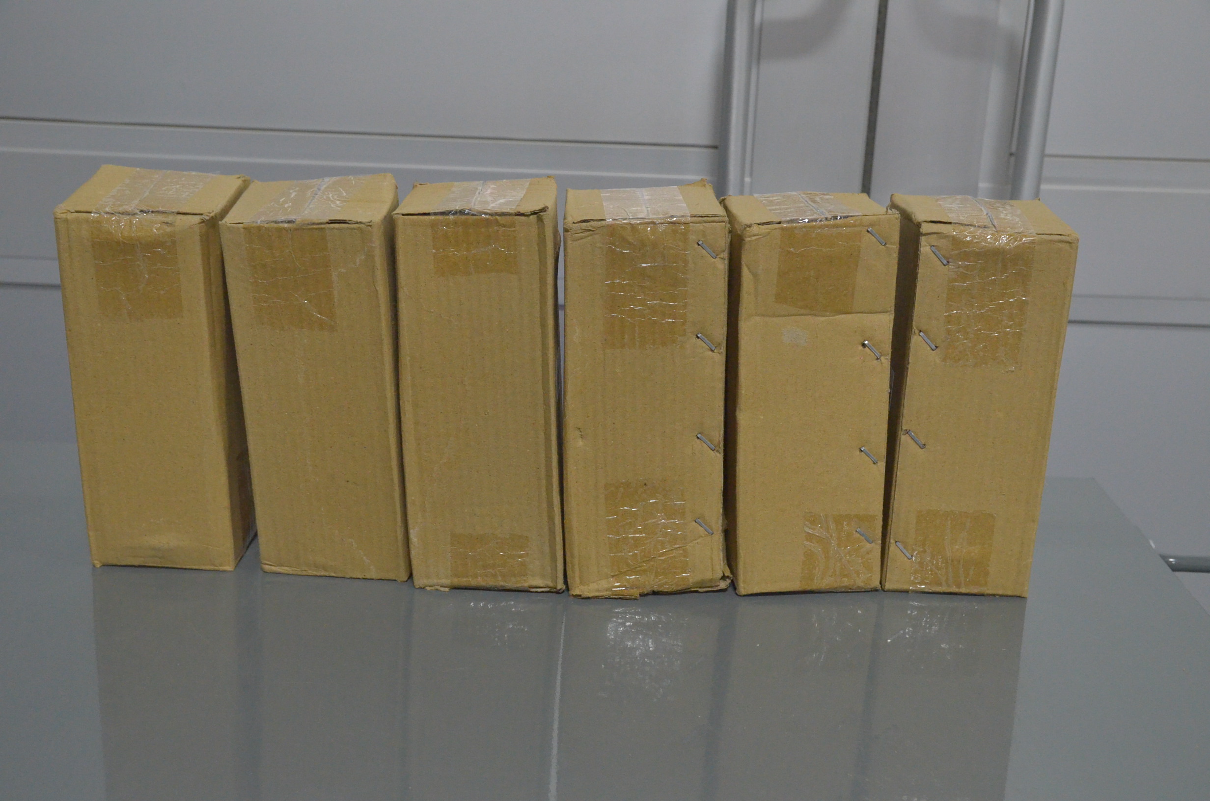 lot 53 image: Lot of 6 - 3 in. x 8 in. New Traditional Metal and Glass Floating Sand Timer