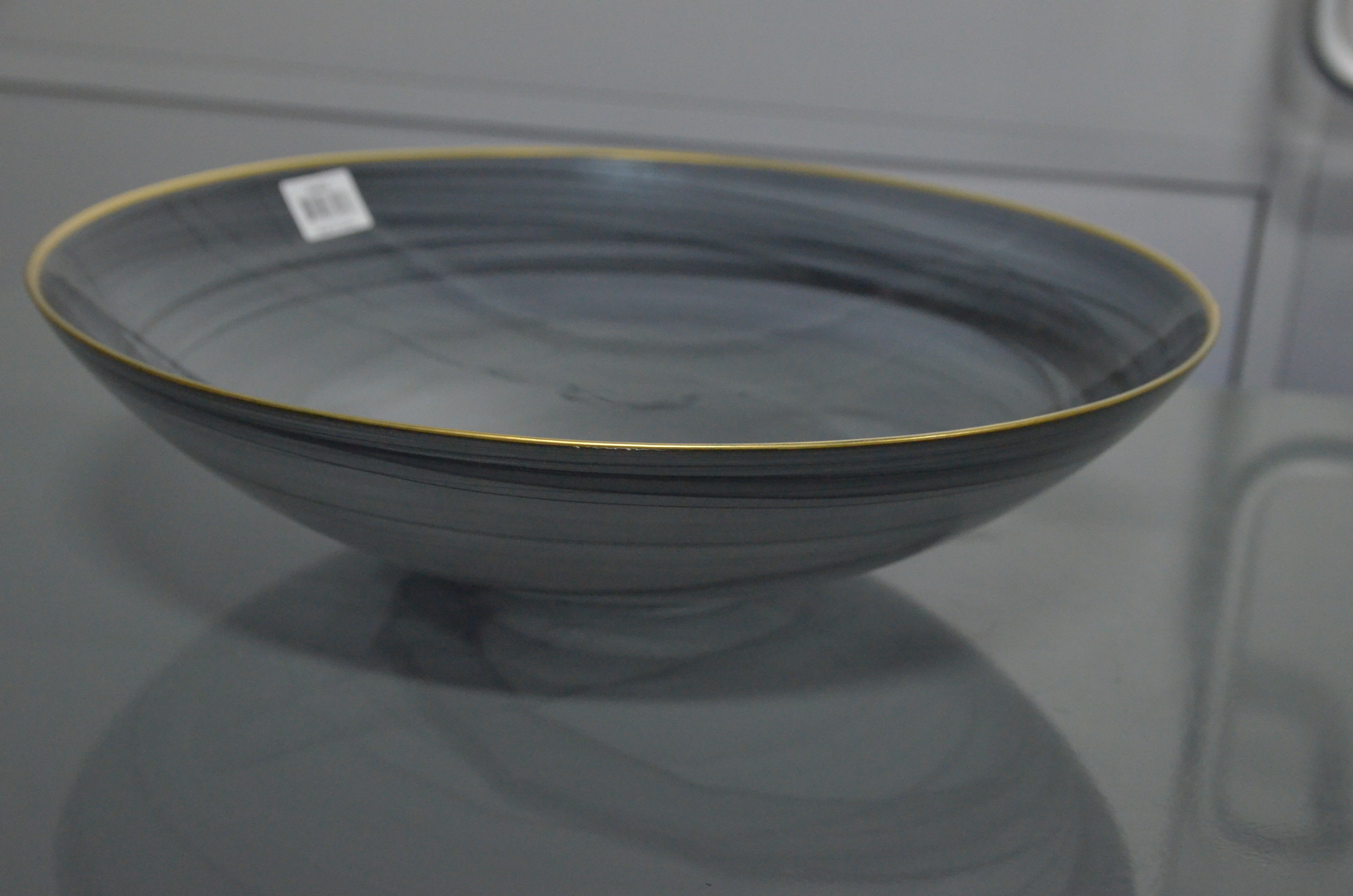 lot 56 image: Yorkshire Black Decorative Glass Charger