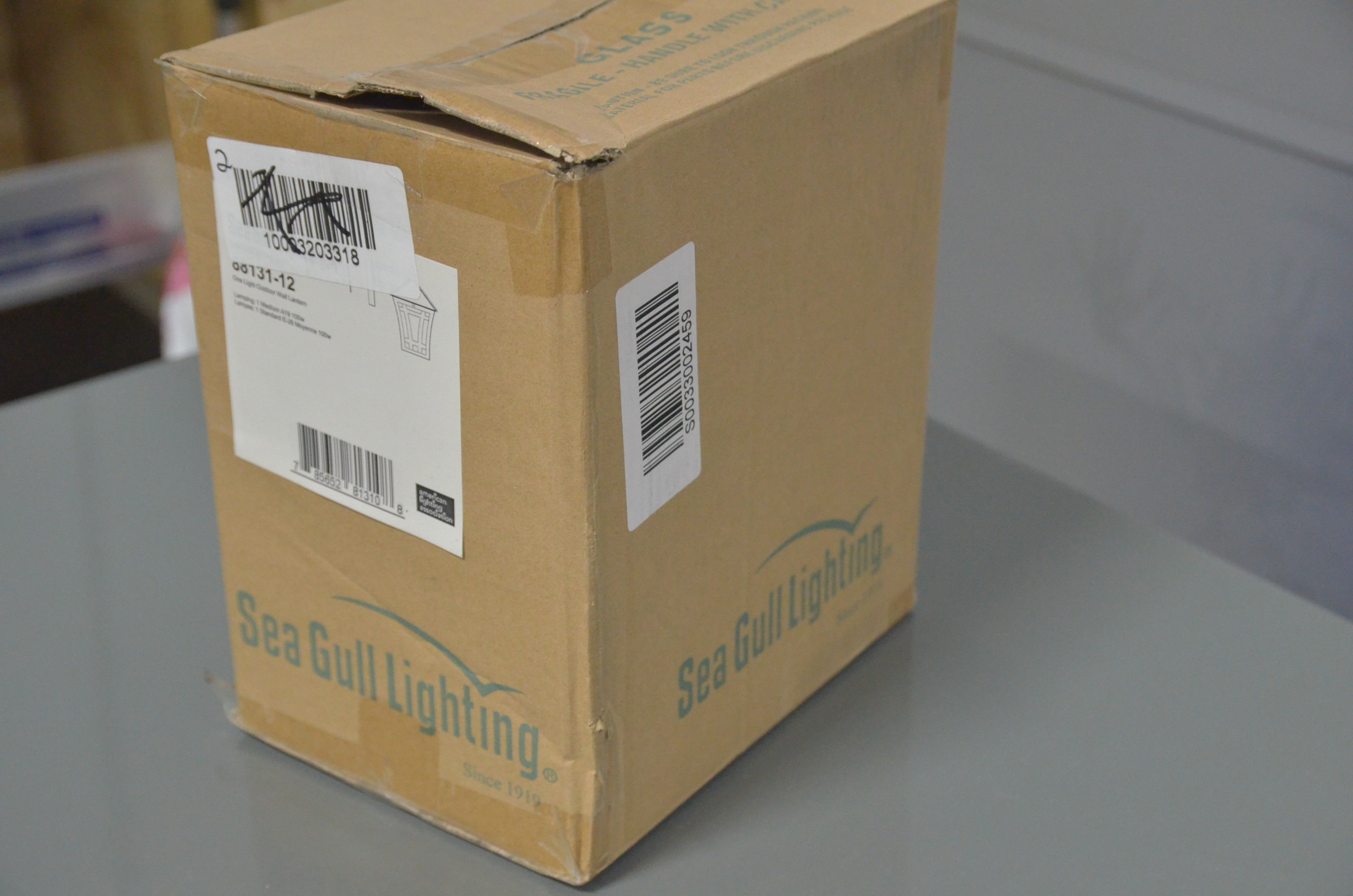lot 73 image: Sea Gull LIghting Herrington Small 1-Light Black Outdoor Wall Mount Lantern
