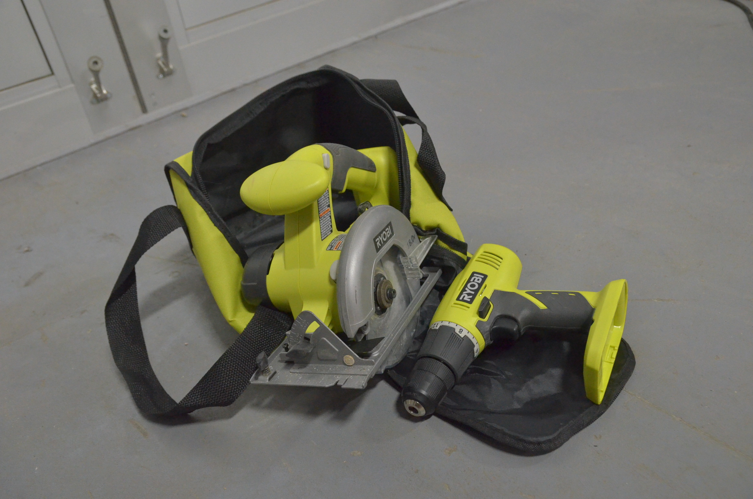 lot 83 image: Ryobi Circular Saw and Drill. Bare tools only with bag.