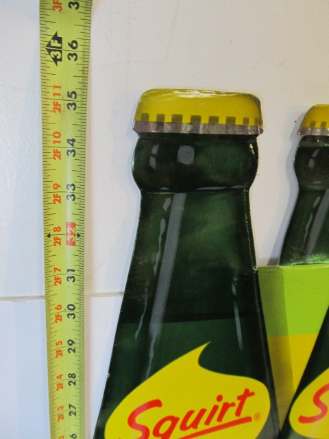 lot 200 image: LARGE Vintage 1960s Advertising SQUIRT Soda Embossed Display Sign