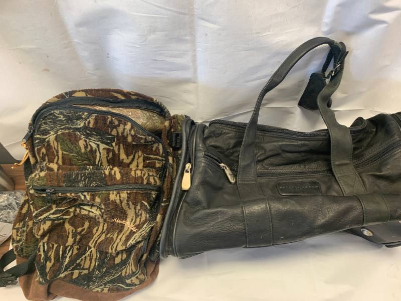 lot 17 image: Sharper Image Leather Bag & Gander Mountain Backpack