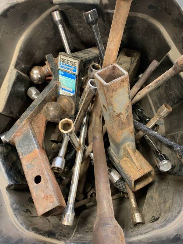 lot 108 image: Hitches, Balls, & Tire Irons (close to 100 lbs)