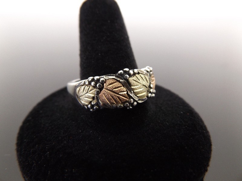 lot 63 image: Mens 12k Black Hills Gold and .925 Sterling Silver Ring Size 12