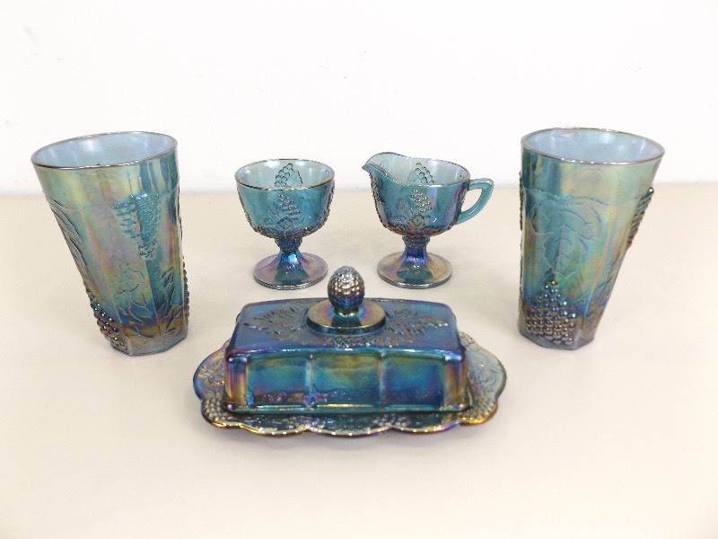 lot 87 image: Vintage Blue Carnival Glass Cream, Sugar, Butter Dish, and Cup Set
