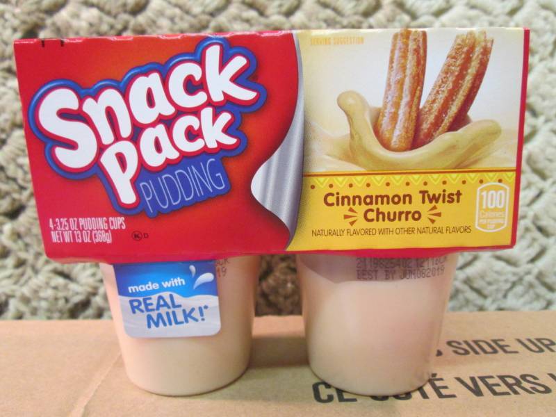 lot 34 image: Case of 12 4-Pack Cups of Cinnamon ...