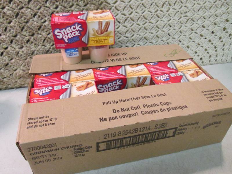 lot 35 image: Case of 12 4-Pack Cups of Cinnamon ...