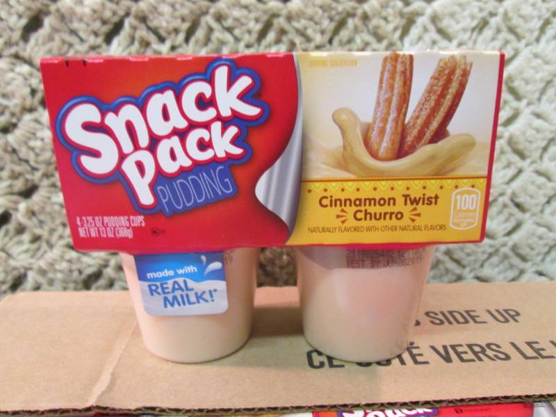 lot 36 image: Case of 12 4-Pack Cups of Cinnamon ...