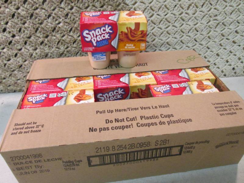 lot 39 image: Case of 12 4-Pack Cups of Dulce de ...
