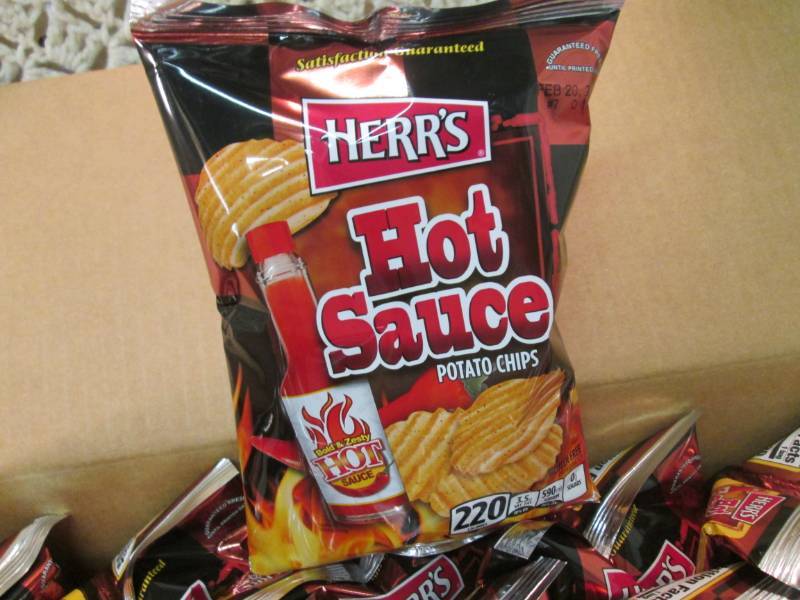 lot 147 image: Case of 30 Bags of Herrs Hot Sauce...