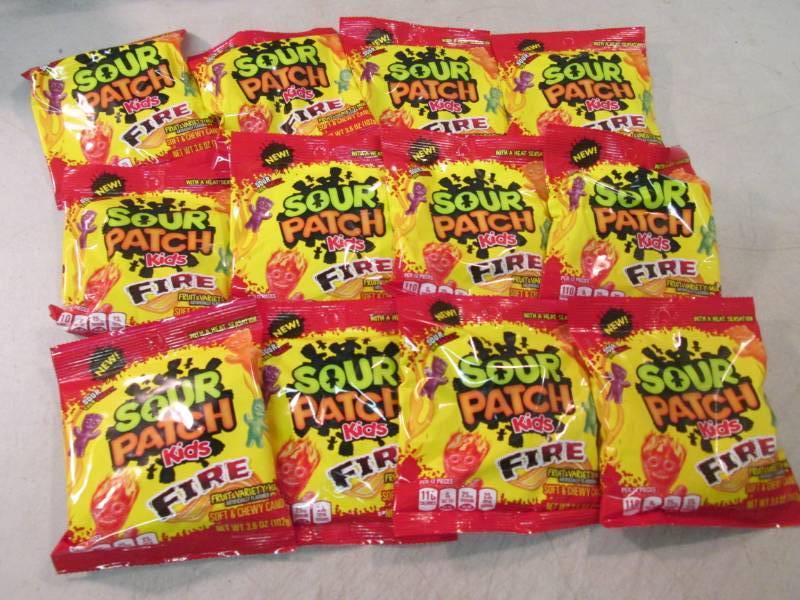 lot 180 image: 12 Bags of Sour Patch Kids Fire Can...