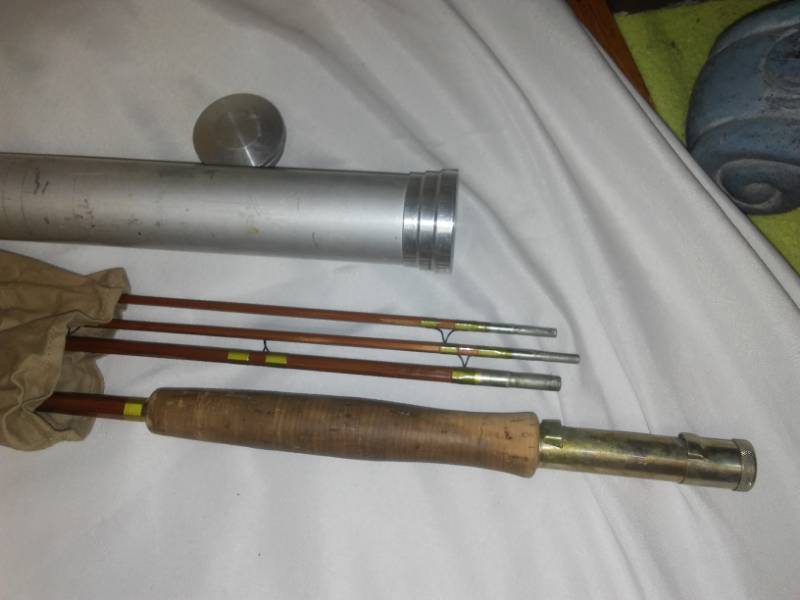 lot 79 image: Vintage fishing pole in canvas, aluminum case
